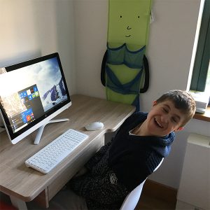 Rhys loves the new touch screen computer with special software - Beaulieu House, Isle of Wight